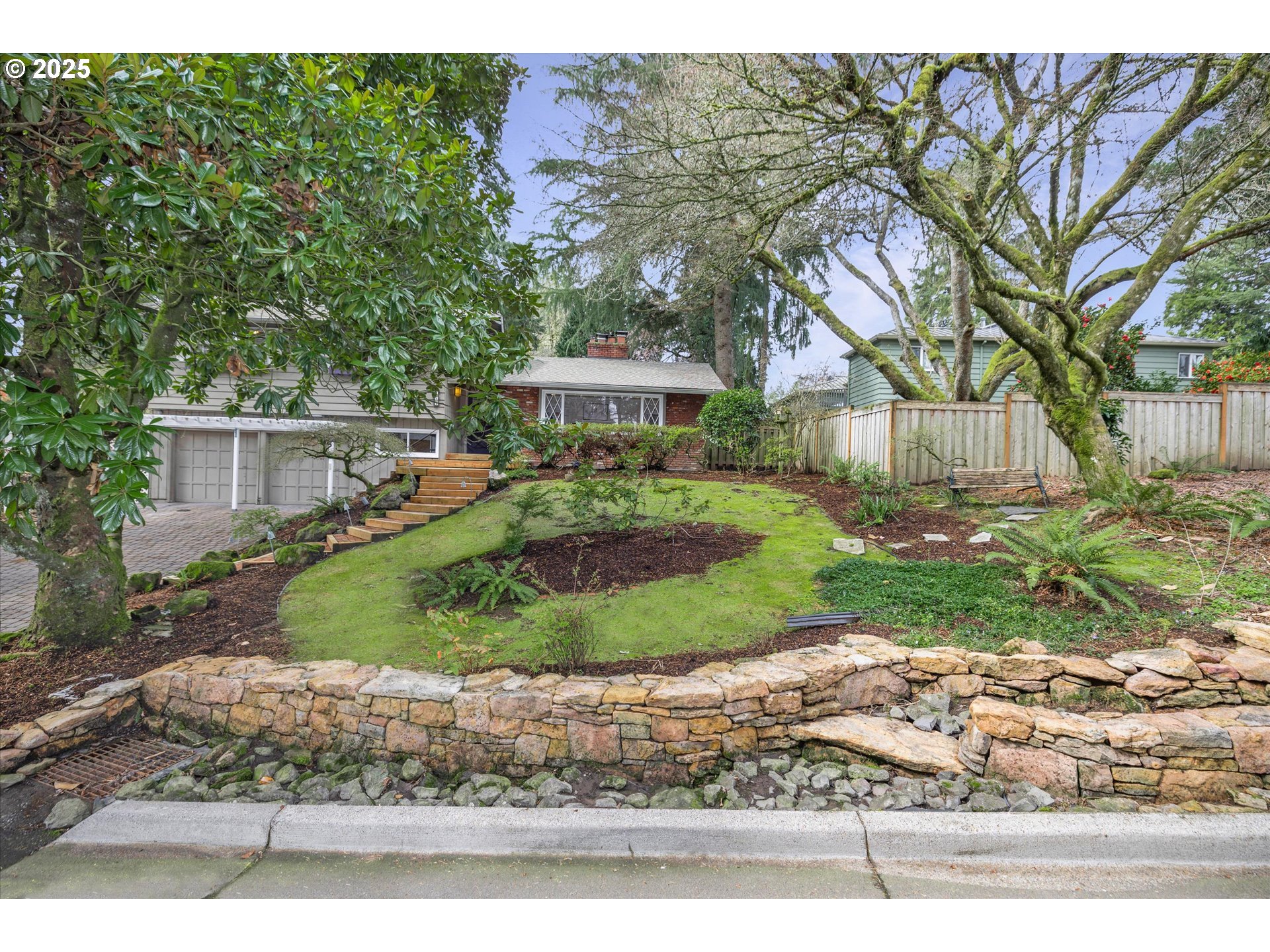 764 10th Street Lake Oswego, OR 97034 - Photo 4 of 41 a front view of a house with a yard and potted plants
