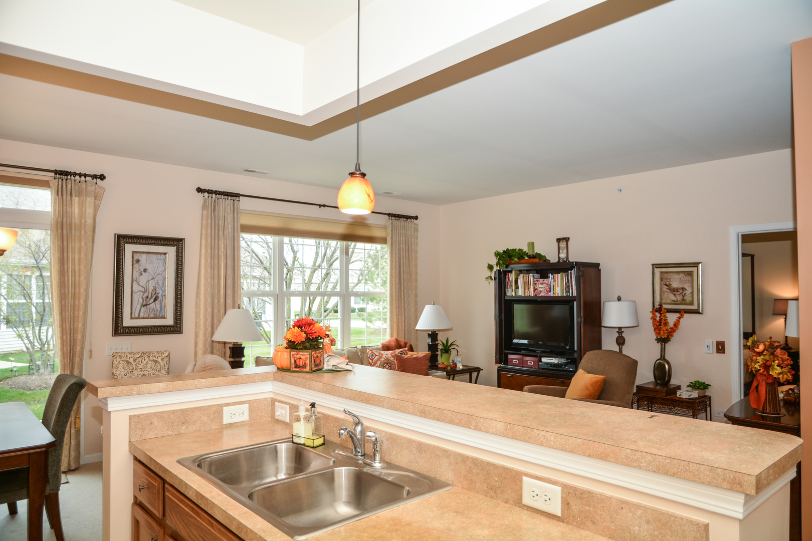 13656 Hemlock Road Huntley, IL 60142 - Photo 8 of 19 a view of a kitchen with kitchen island a sink and a large window
