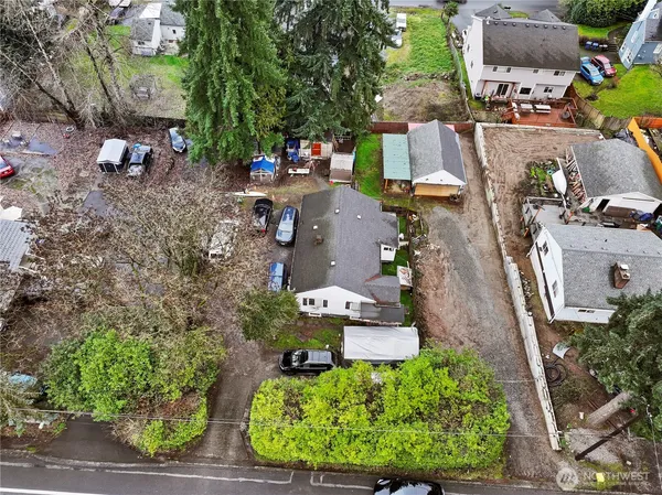 an aerial view of a house with a yard