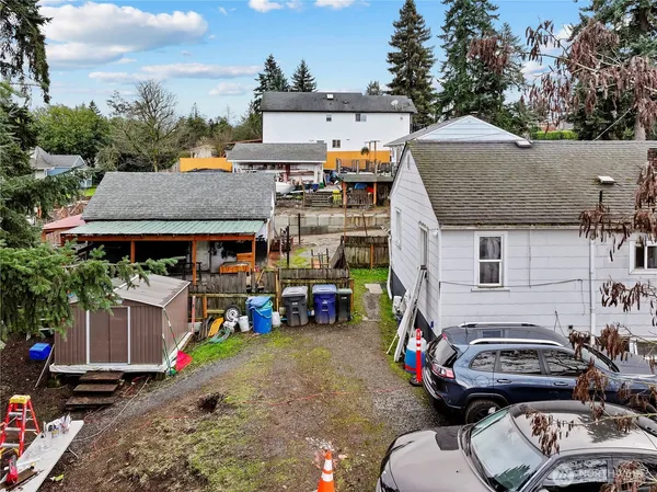 a view of parked car and front view of a house