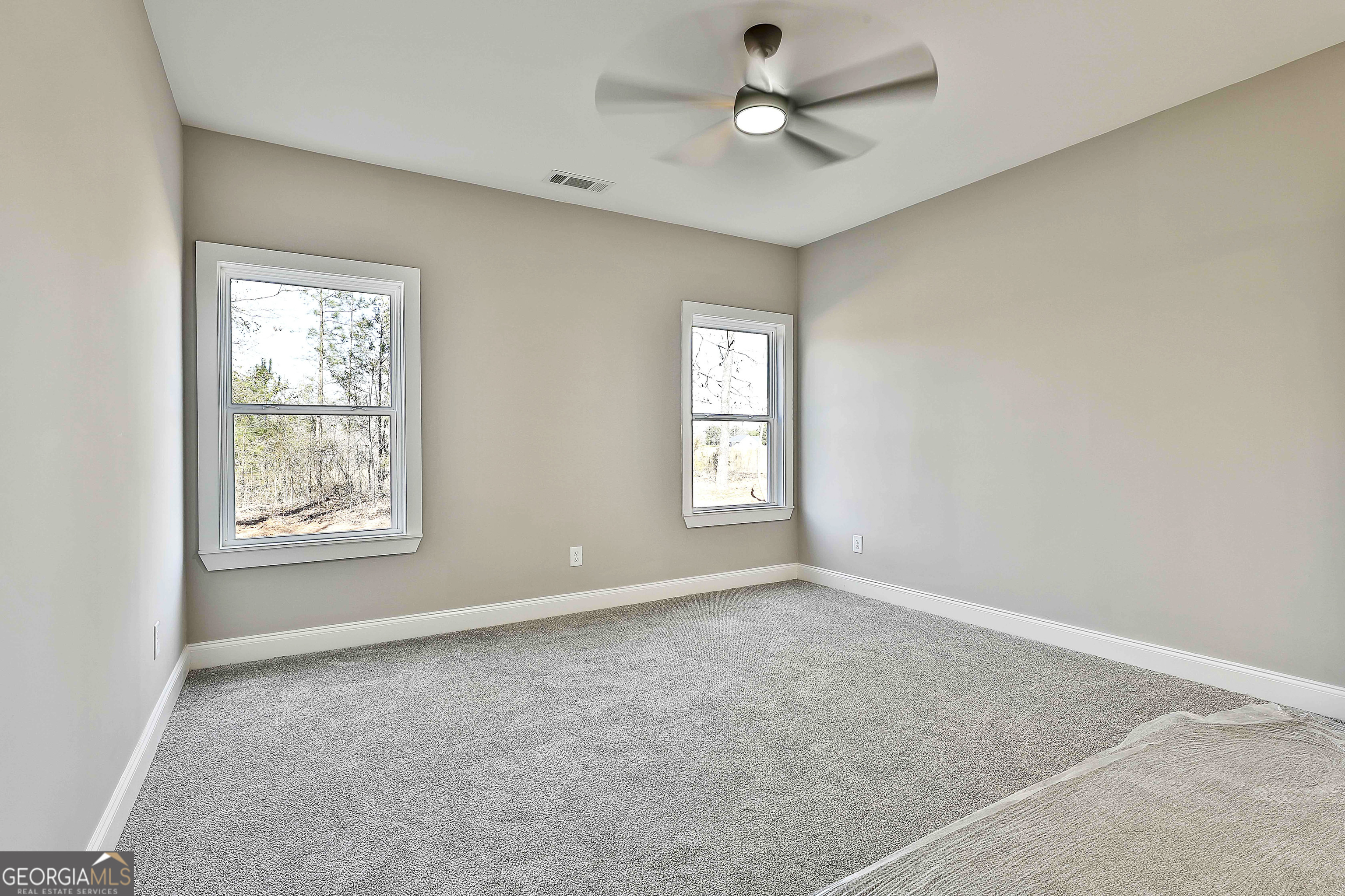 35 Oak Road Locust Grove, GA 30248 - Photo 18 of 36 a view of an empty room with a window