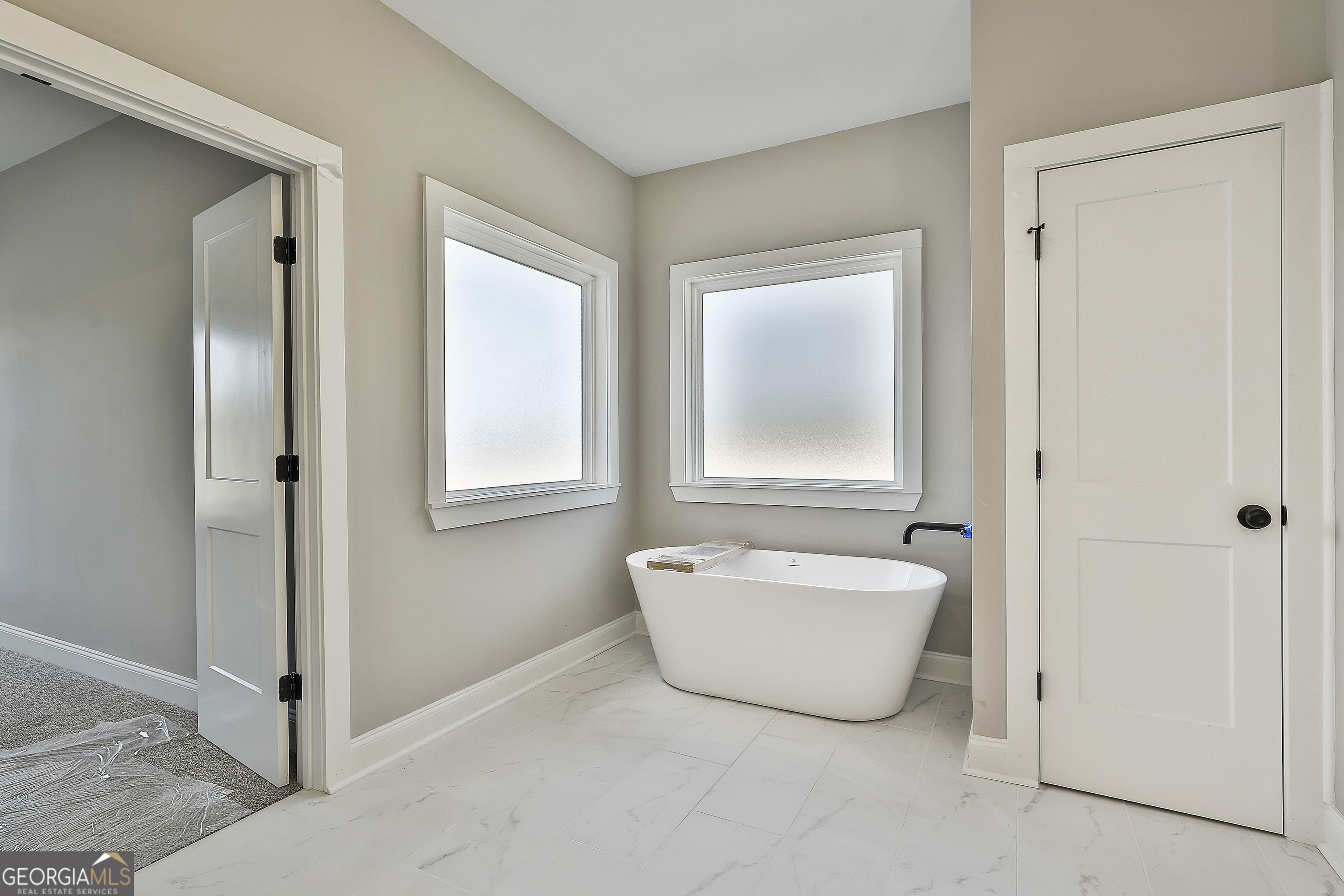 35 Oak Road Locust Grove, GA 30248 - Photo 22 of 36 a spacious bathroom with a bathtub and shower