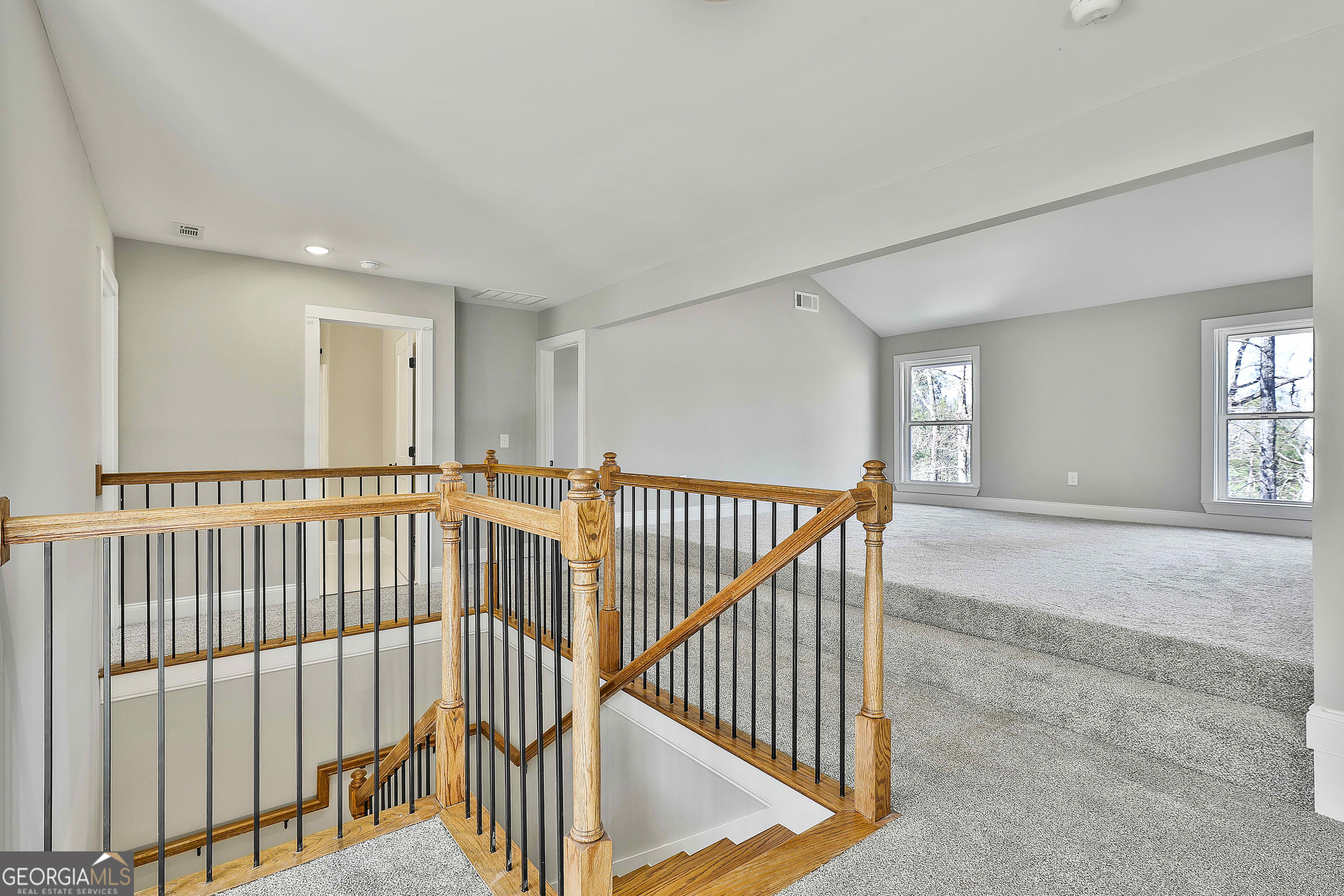 35 Oak Road Locust Grove, GA 30248 - Photo 24 of 36 a view of a hallway with wooden floor and windows