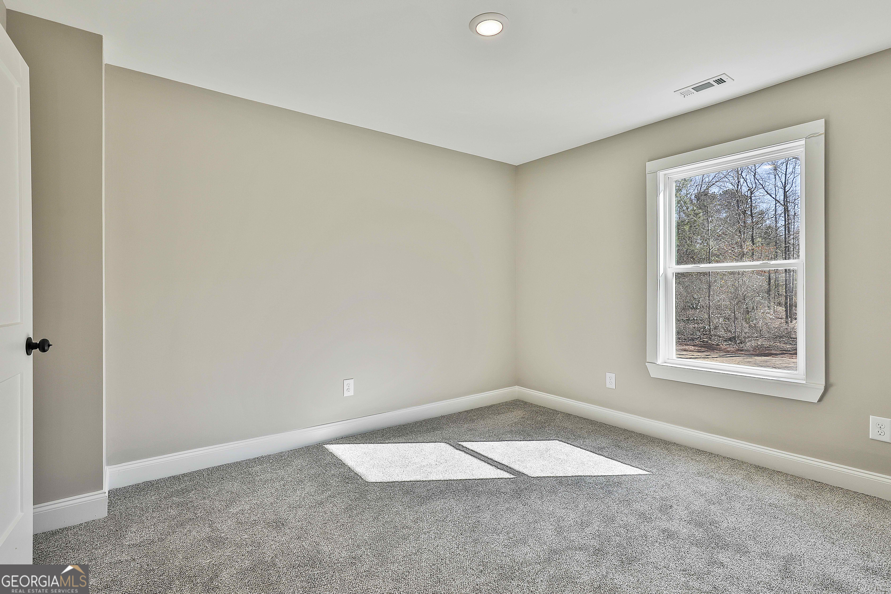 35 Oak Road Locust Grove, GA 30248 - Photo 27 of 36 an empty room with a window