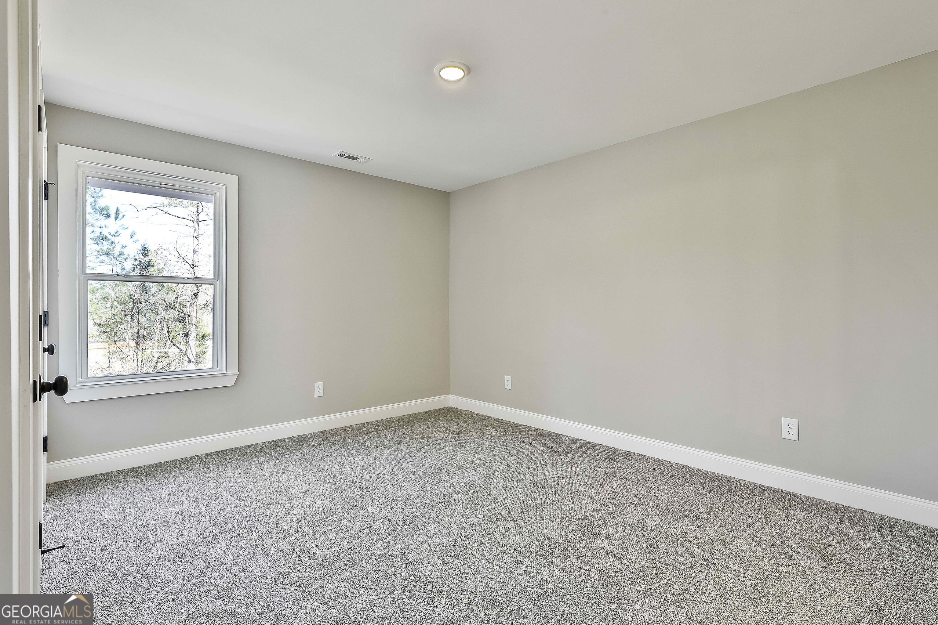 35 Oak Road Locust Grove, GA 30248 - Photo 29 of 36 an empty room with a window