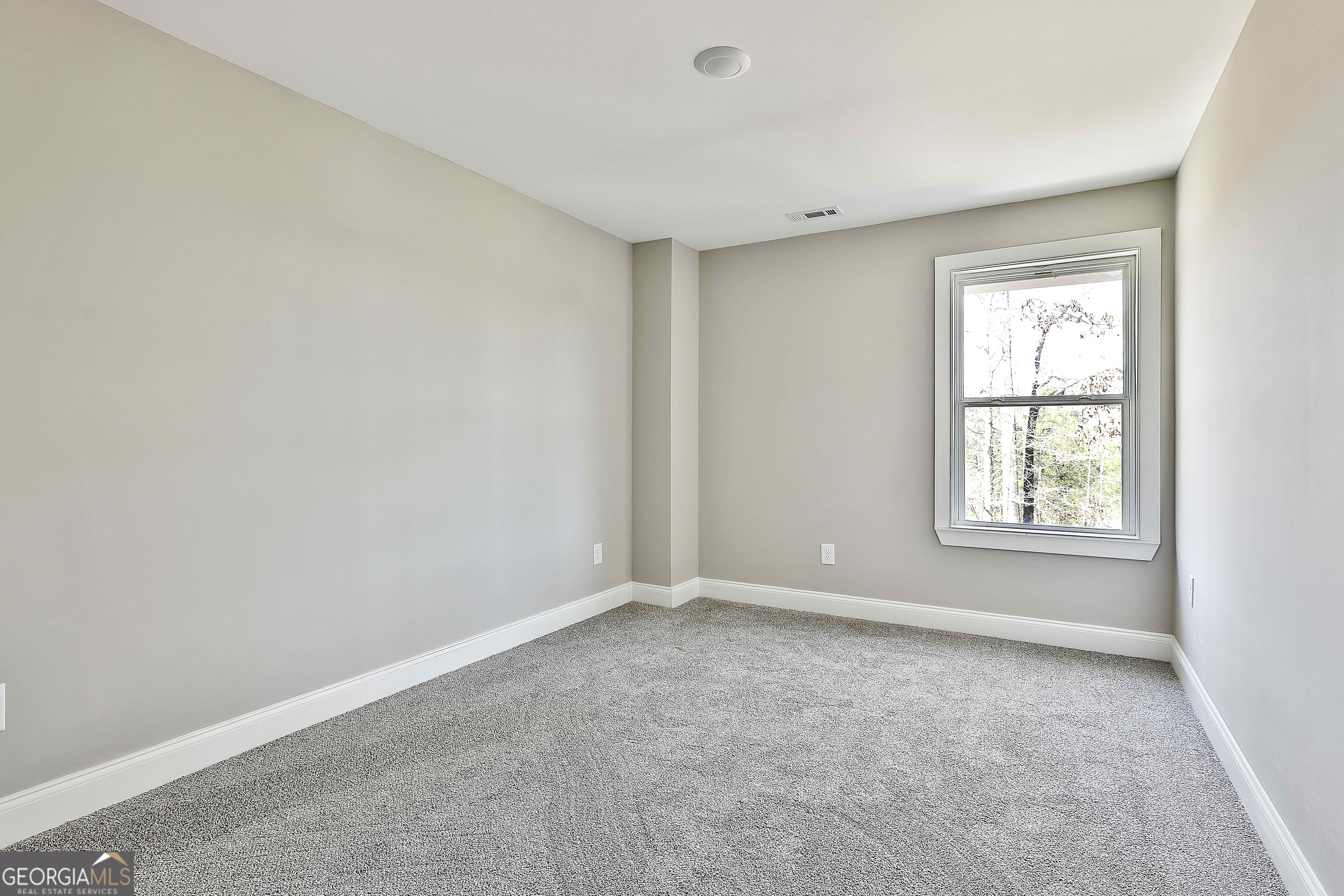 35 Oak Road Locust Grove, GA 30248 - Photo 30 of 36 a view of an empty room with a window