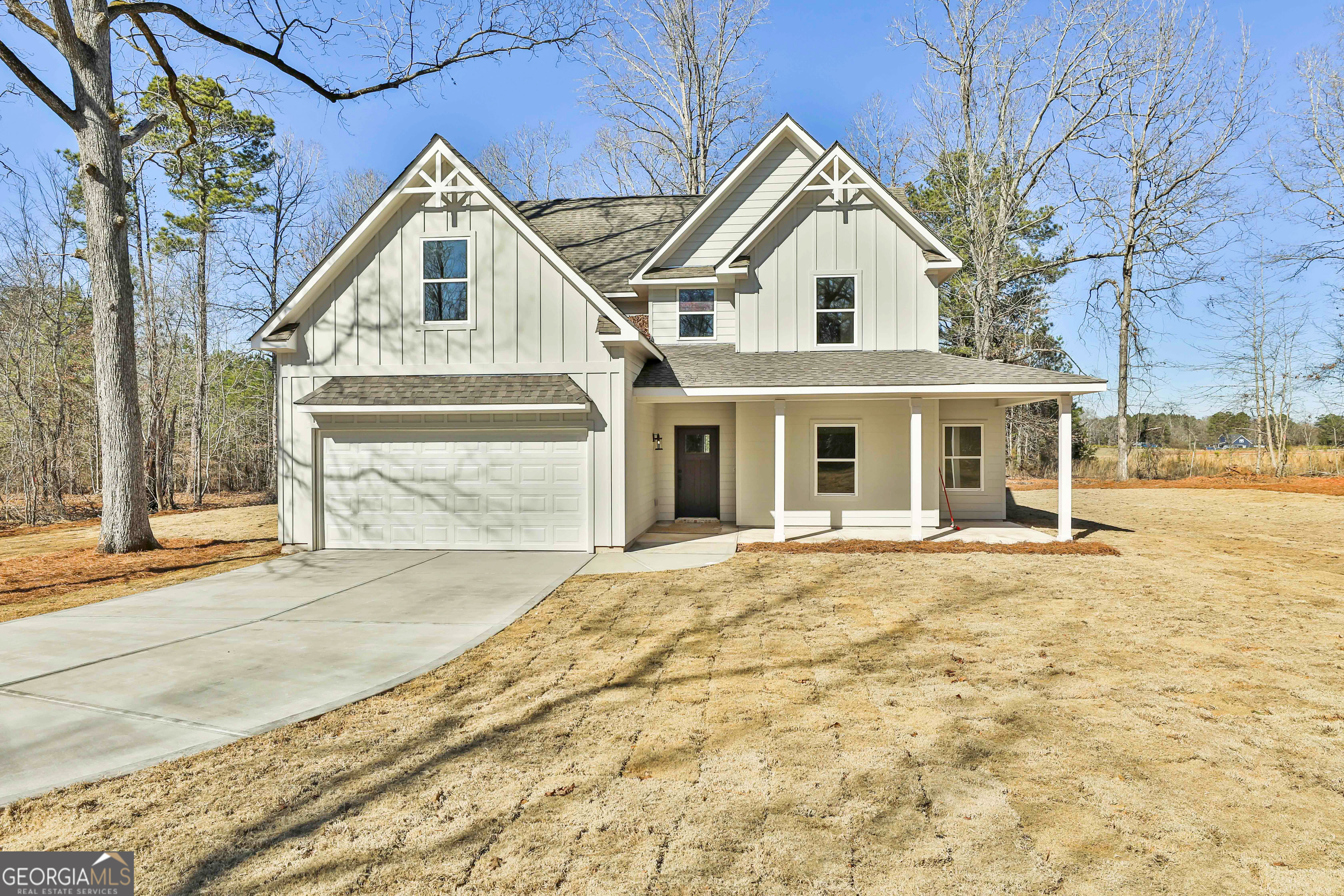 35 Oak Road Locust Grove, GA 30248 - Photo 4 of 36 a front view of a house with a yard