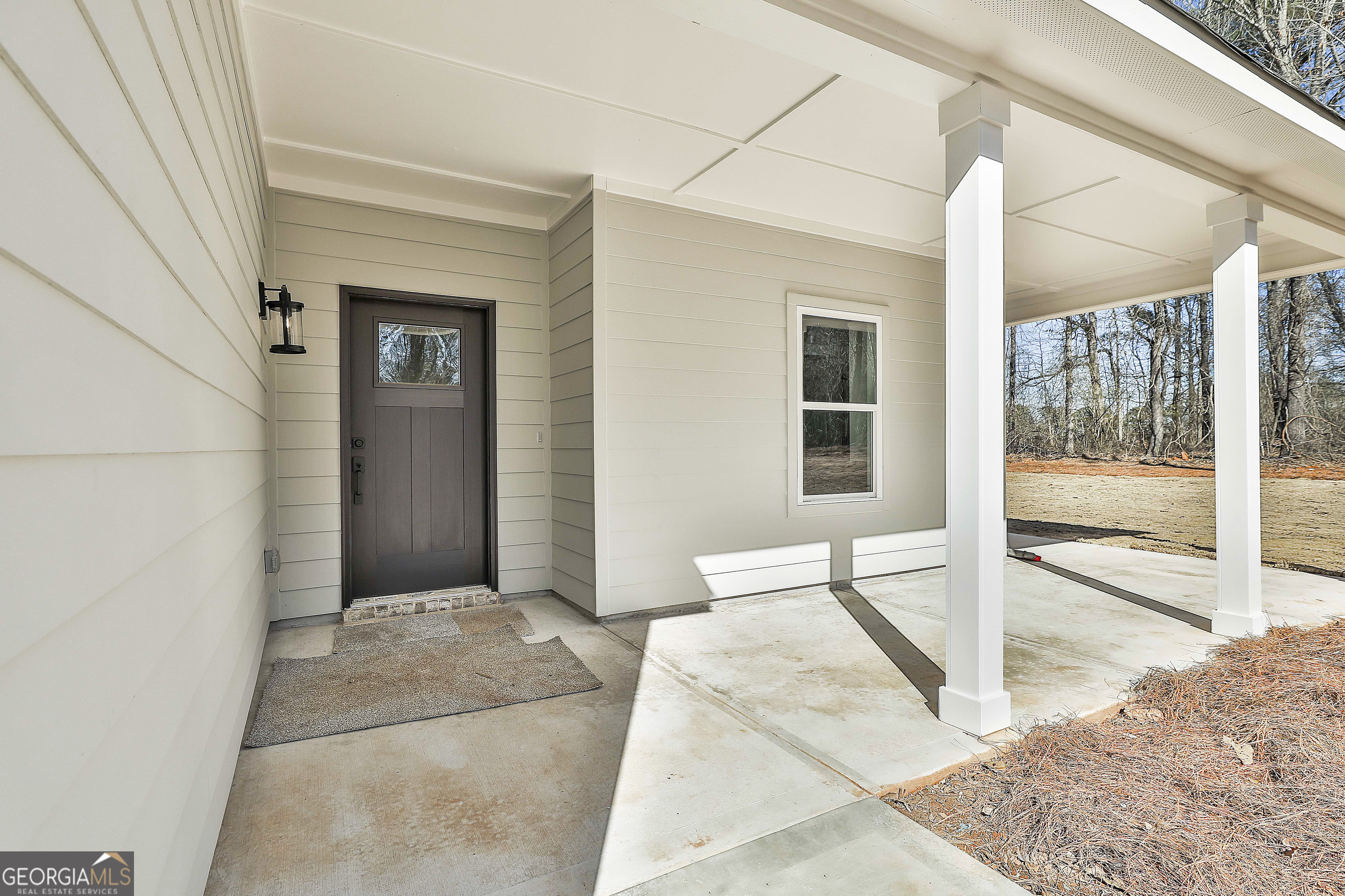 35 Oak Road Locust Grove, GA 30248 - Photo 5 of 36 a view of a bedroom with wooden floor and windows
