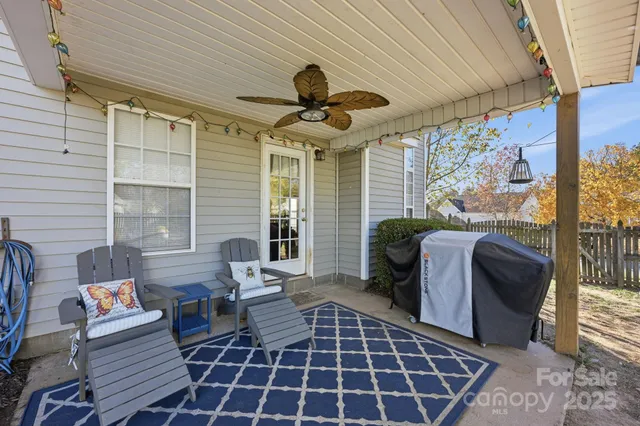 a front view of a house with outdoor seating