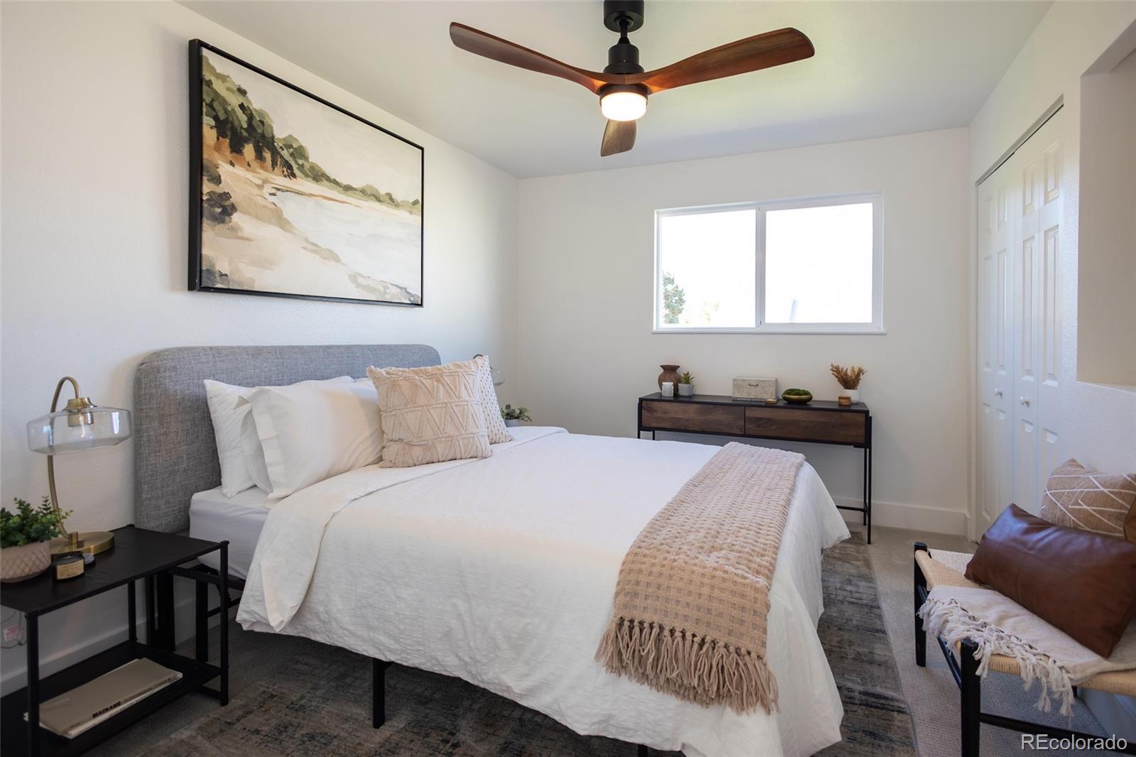 5711 West 92nd Avenue, Unit 20 Westminster, CO 80031 - Photo 11 of 26 a bedroom with bed and a window