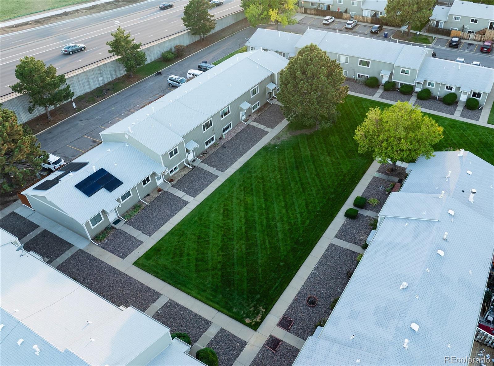5711 West 92nd Avenue, Unit 20 Westminster, CO 80031 - Photo 24 of 26 a view of a yard with potted plants