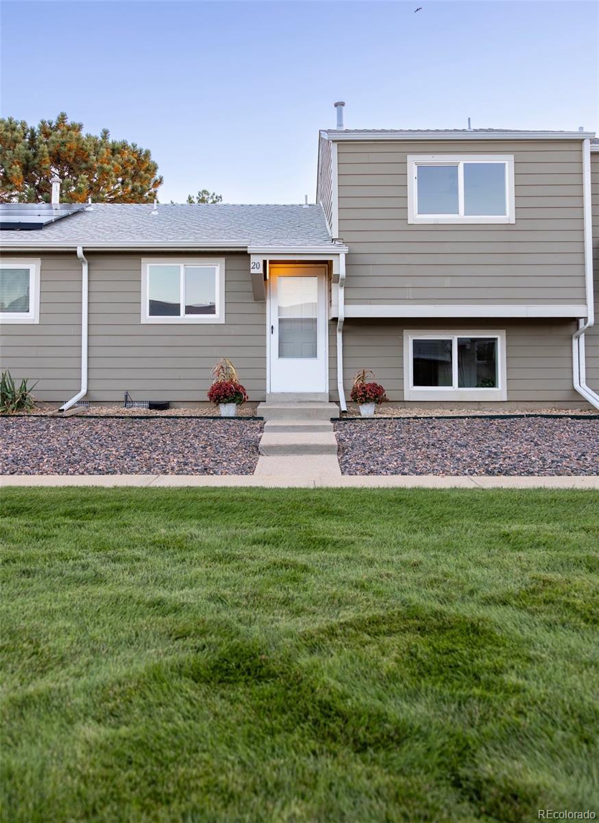 5711 West 92nd Avenue, Unit 20 Westminster, CO 80031 - Photo 3 of 26 a front view of house with yard