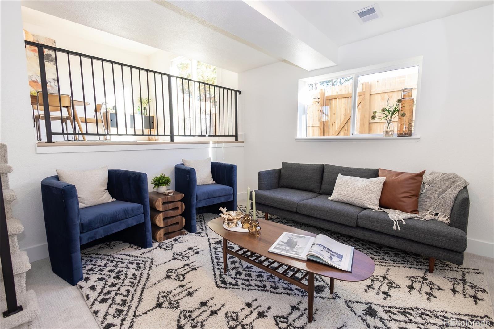 5711 West 92nd Avenue, Unit 20 Westminster, CO 80031 - Photo 8 of 26 a living room with furniture and a window