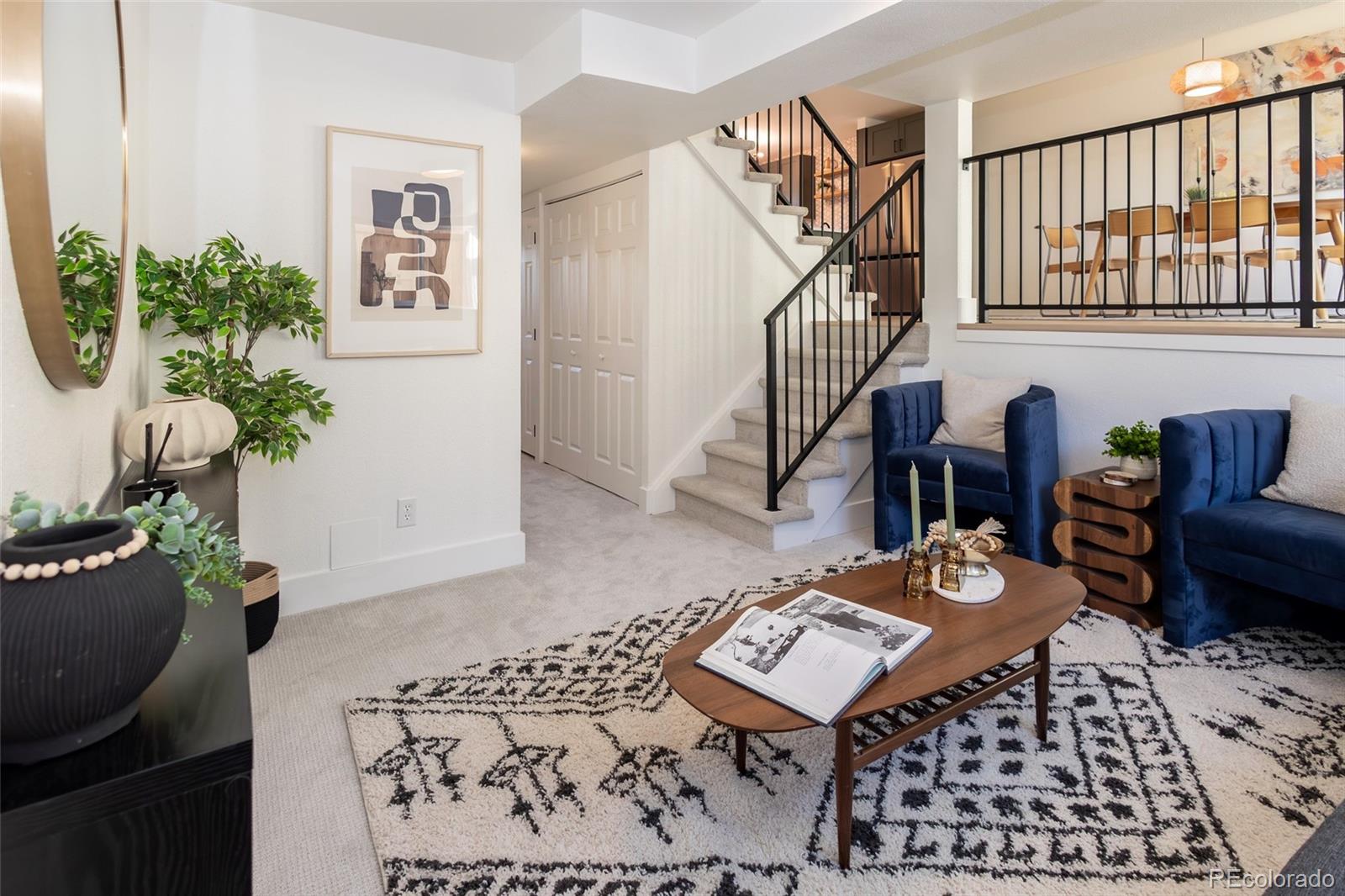 5711 West 92nd Avenue, Unit 20 Westminster, CO 80031 - Photo 9 of 26 a living room with furniture and a potted plant