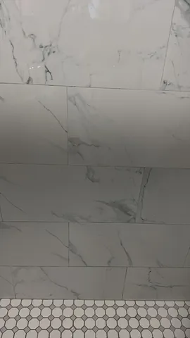 a kitchen with granite countertop a stove a sink and a refrigerator