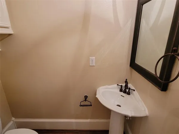 a bathroom with a sink and mirror