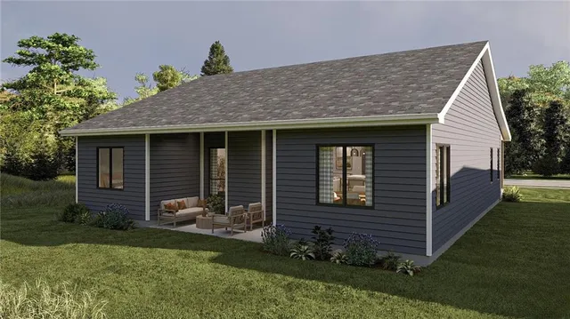 a view of a house with a yard and potted plants