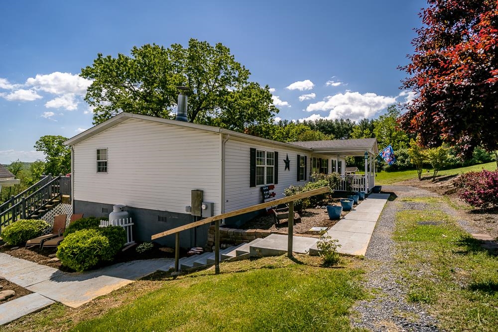 1271 Union Church Road Churchville, VA 24421 - Photo 20 of 46 a front view of house with a garden and swimming pool