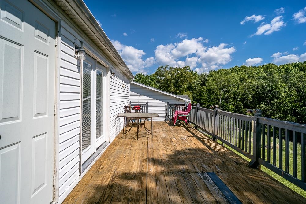 1271 Union Church Road Churchville, VA 24421 - Photo 22 of 46 a view of a balcony with wooden floor and large trees