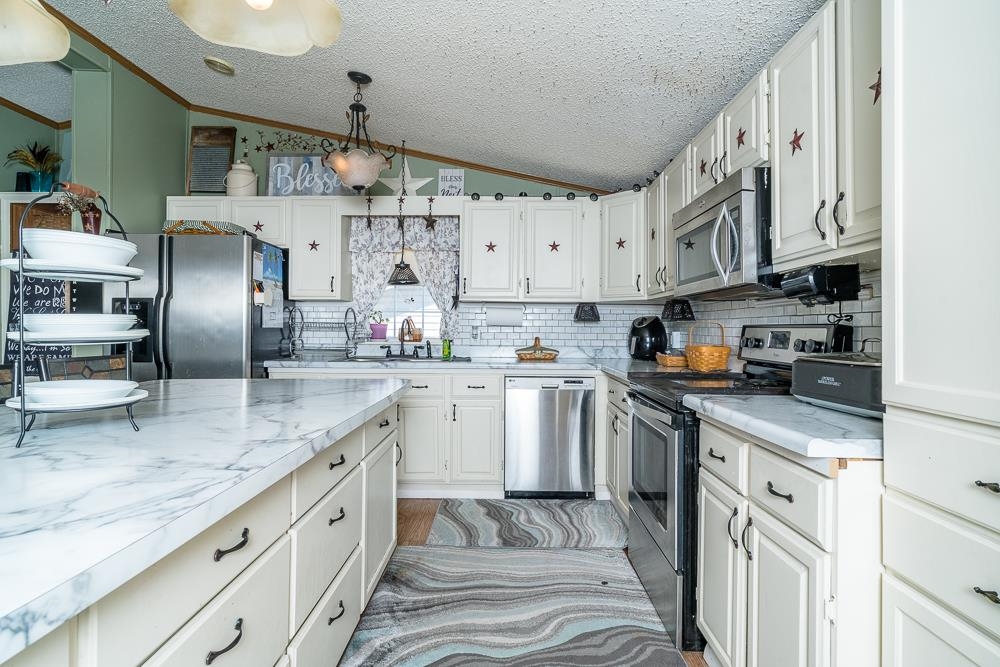 1271 Union Church Road Churchville, VA 24421 - Photo 3 of 46 a kitchen with stainless steel appliances granite countertop a sink a stove and cabinets