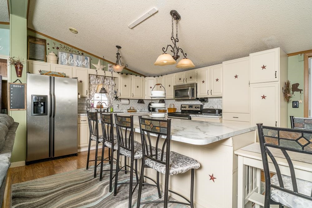 1271 Union Church Road Churchville, VA 24421 - Photo 4 of 46 a kitchen with stainless steel appliances granite countertop a refrigerator and microwave