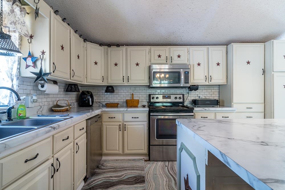 1271 Union Church Road Churchville, VA 24421 - Photo 5 of 46 a kitchen with cabinets appliances a sink and a counter top space