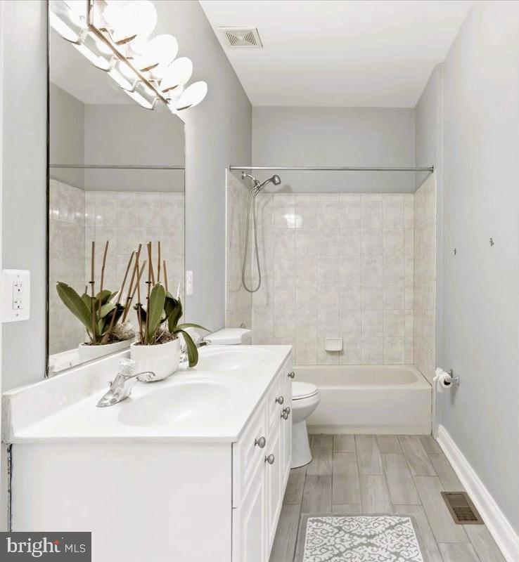 13305 Old Fort Road Fort Washington, MD 20744 - Photo 20 of 41 a bathroom with a sink a toilet and shower