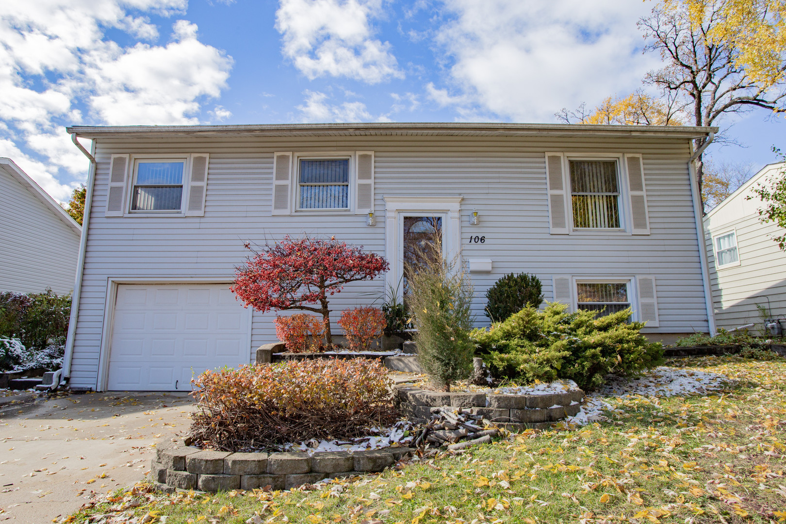 106 Woodcrest Circle Streamwood, IL 60107 - Photo 1 of 29 a house view with a garden space