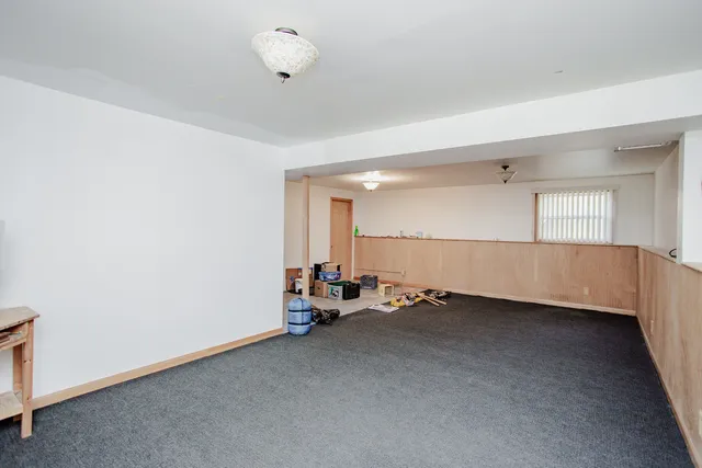 a view of a room with gym equipment and a window