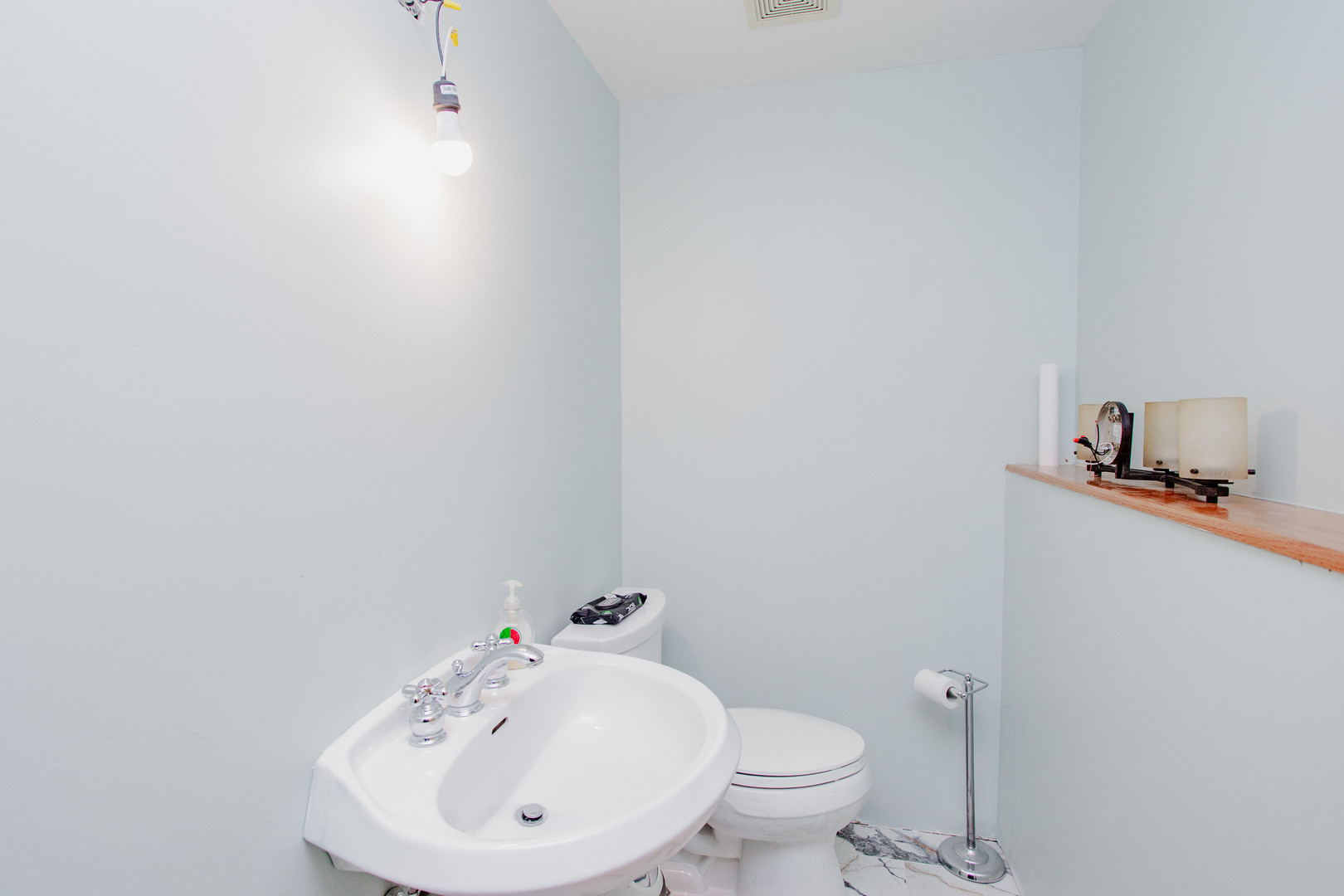 106 Woodcrest Circle Streamwood, IL 60107 - Photo 20 of 29 a bathroom with a sink a toilet and mirror