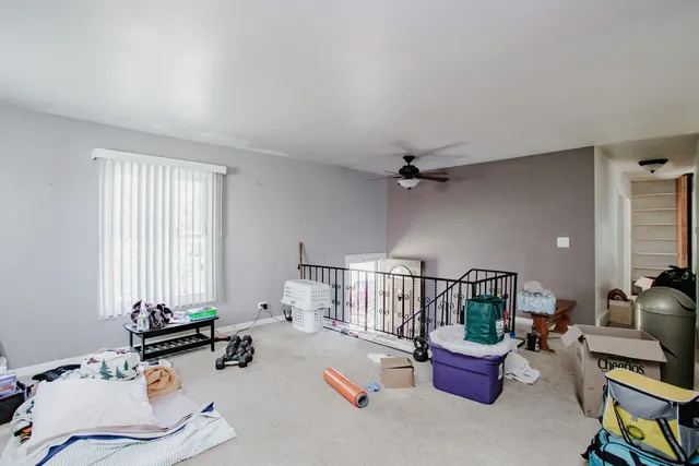 a bedroom with furniture and a window