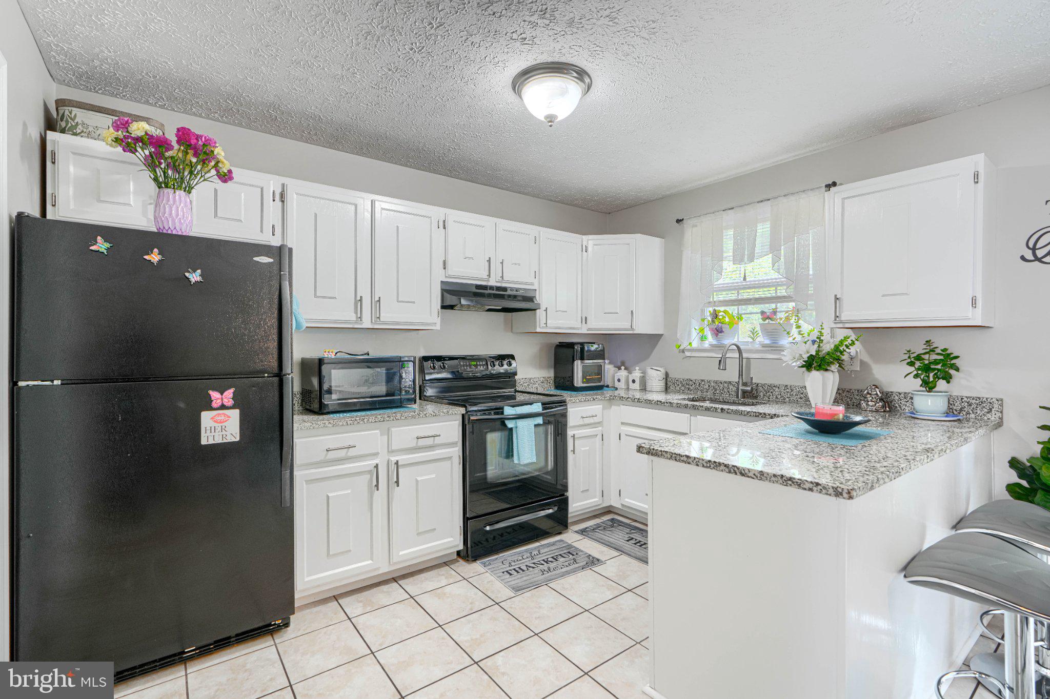 4067 Rustico Road Baltimore, MD 21220 - Photo 14 of 31 Bright and inviting kitchen space.