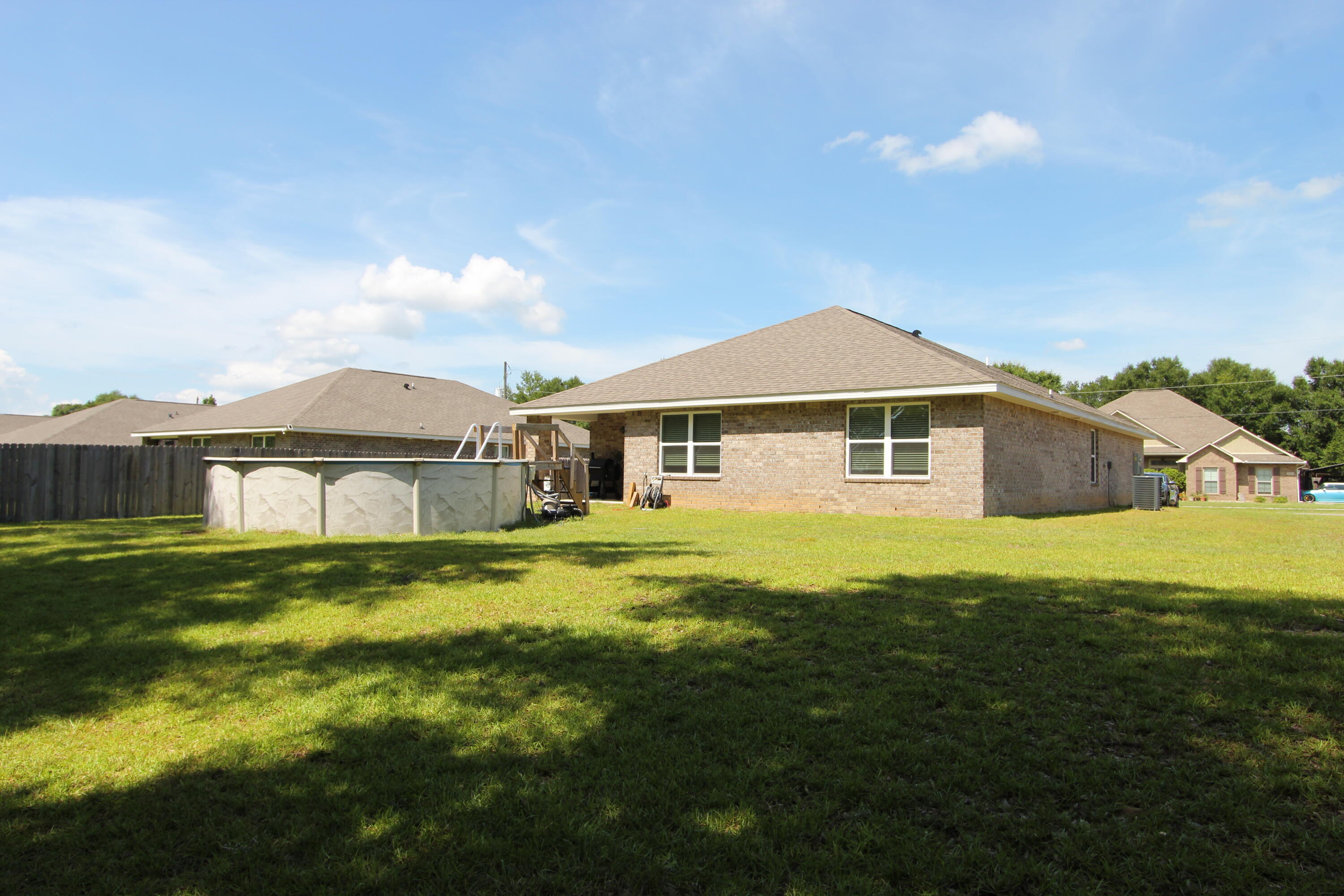 5372 Wyndell Circle Crestview, FL 32539 - Photo 11 of 36 a front view of a house with a yard