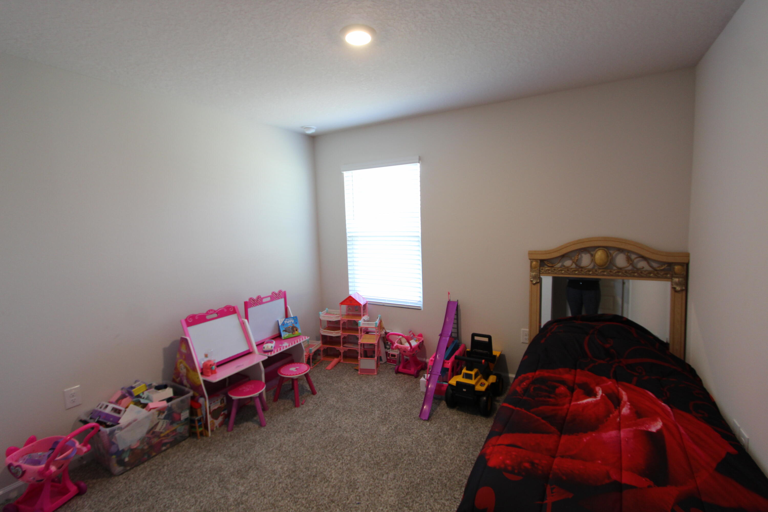 5372 Wyndell Circle Crestview, FL 32539 - Photo 19 of 36 a living room with furniture and a wooden floor