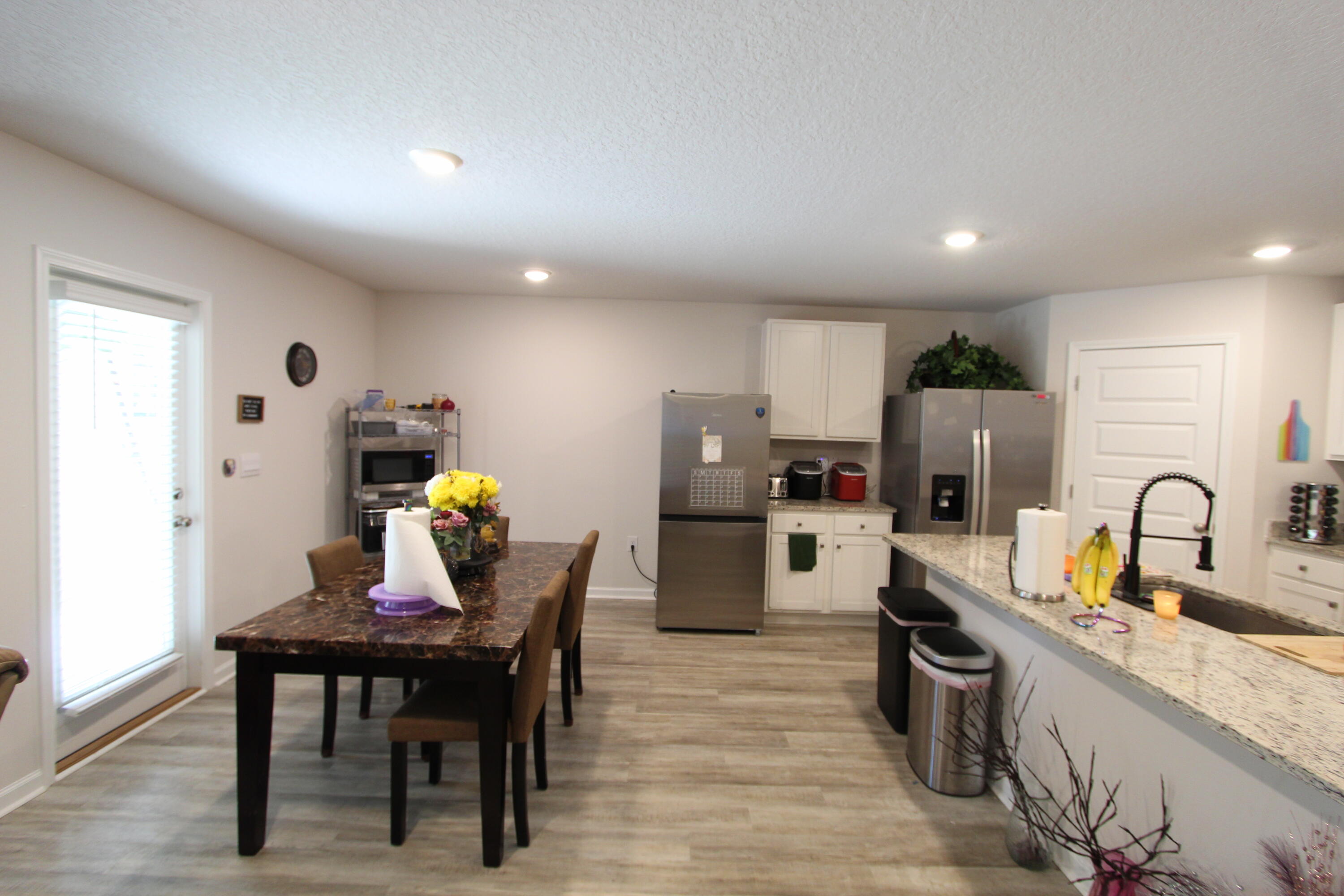 5372 Wyndell Circle Crestview, FL 32539 - Photo 28 of 36 a kitchen with refrigerator and chairs