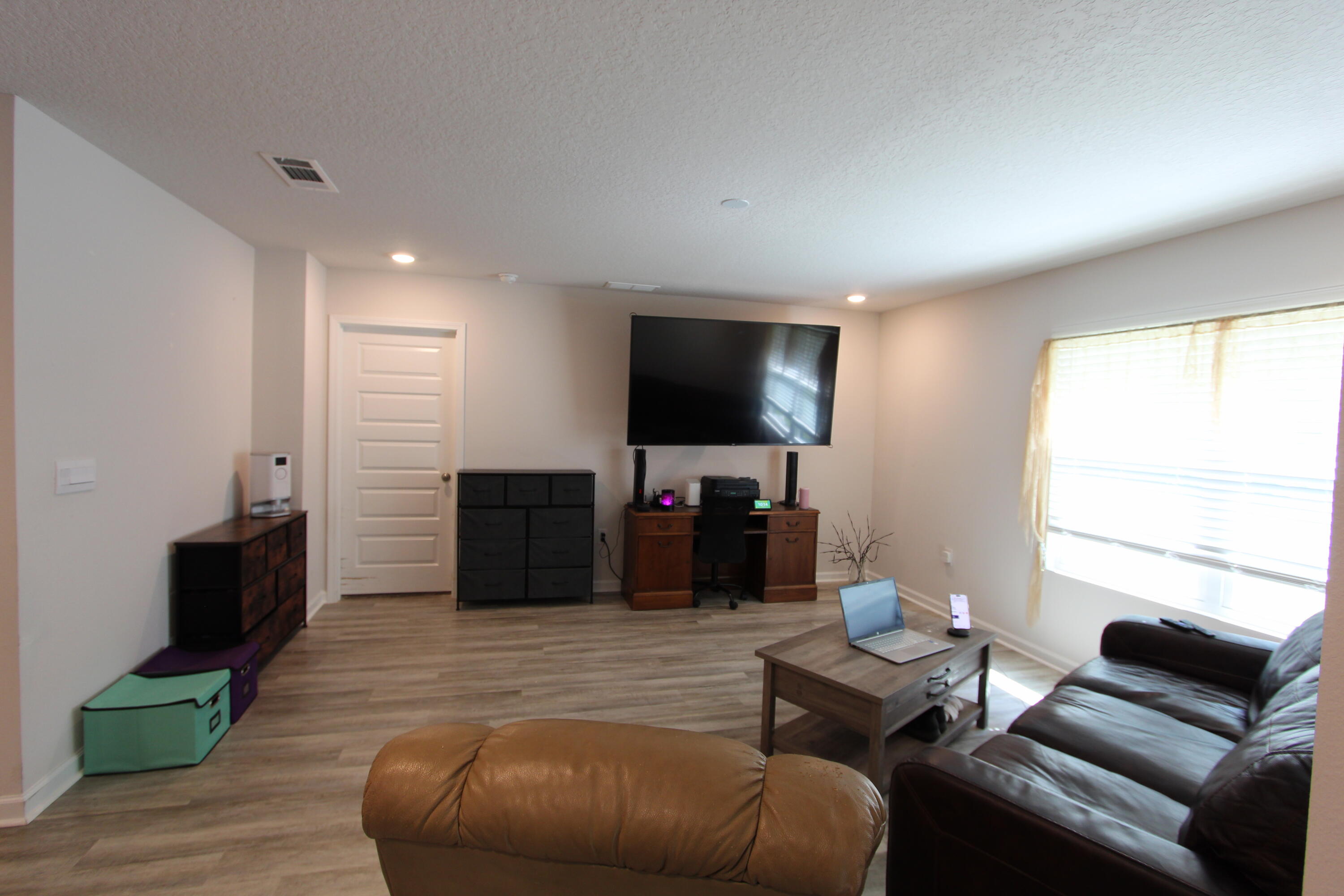 5372 Wyndell Circle Crestview, FL 32539 - Photo 29 of 36 a living room with furniture and a flat screen tv