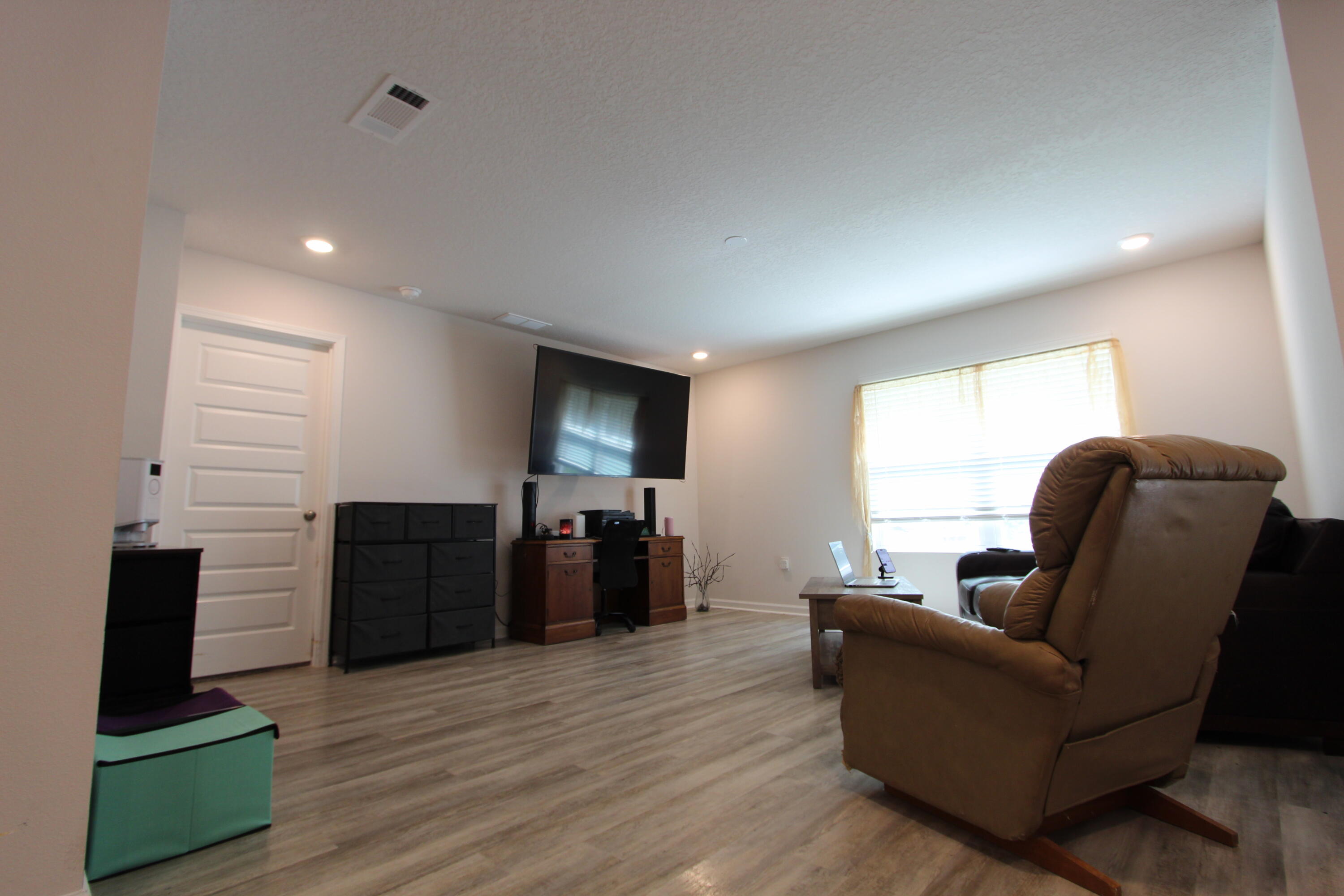 5372 Wyndell Circle Crestview, FL 32539 - Photo 30 of 36 a living room with furniture and a flat screen tv