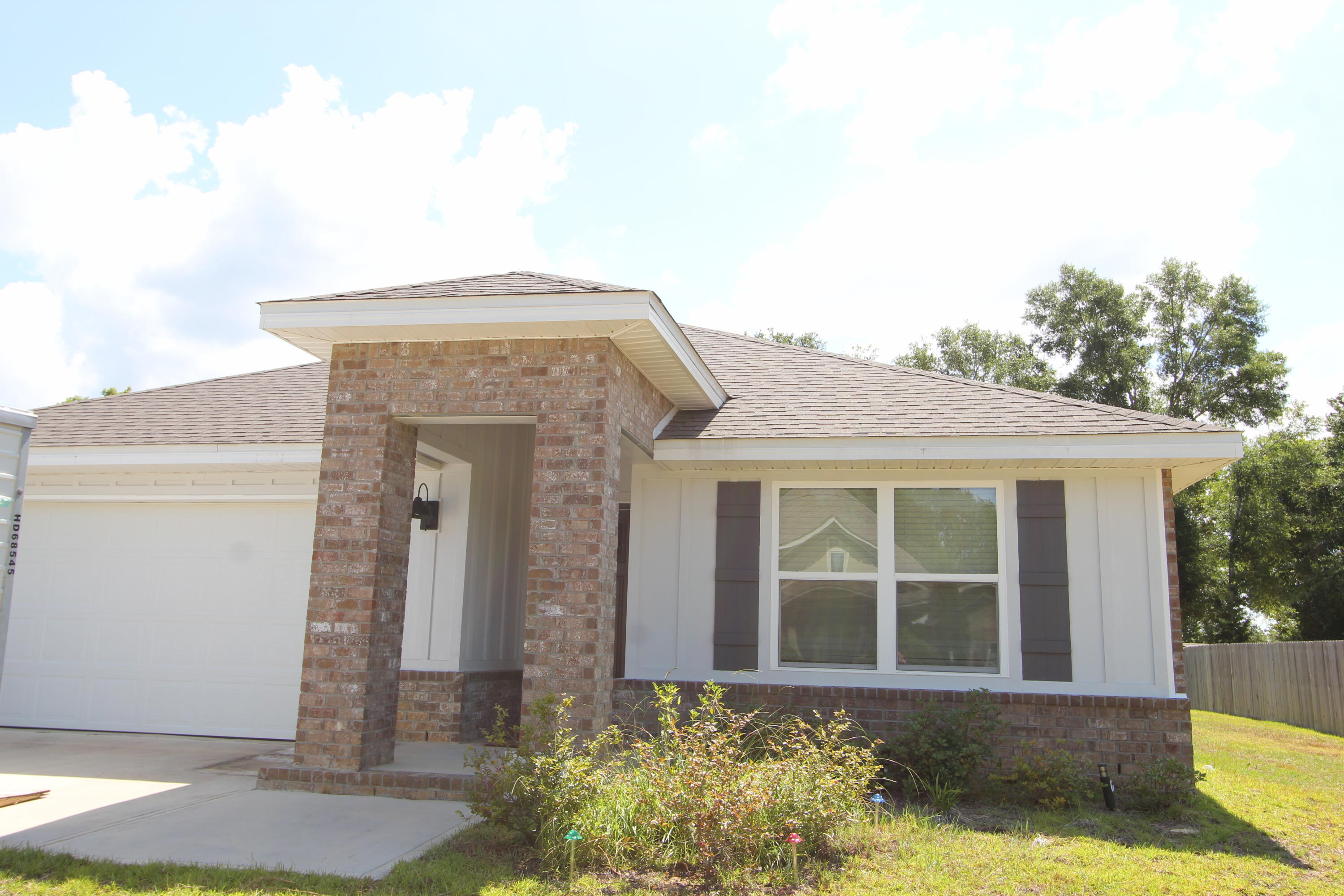5372 Wyndell Circle Crestview, FL 32539 - Photo 3 of 36 a front view of a house with a yard
