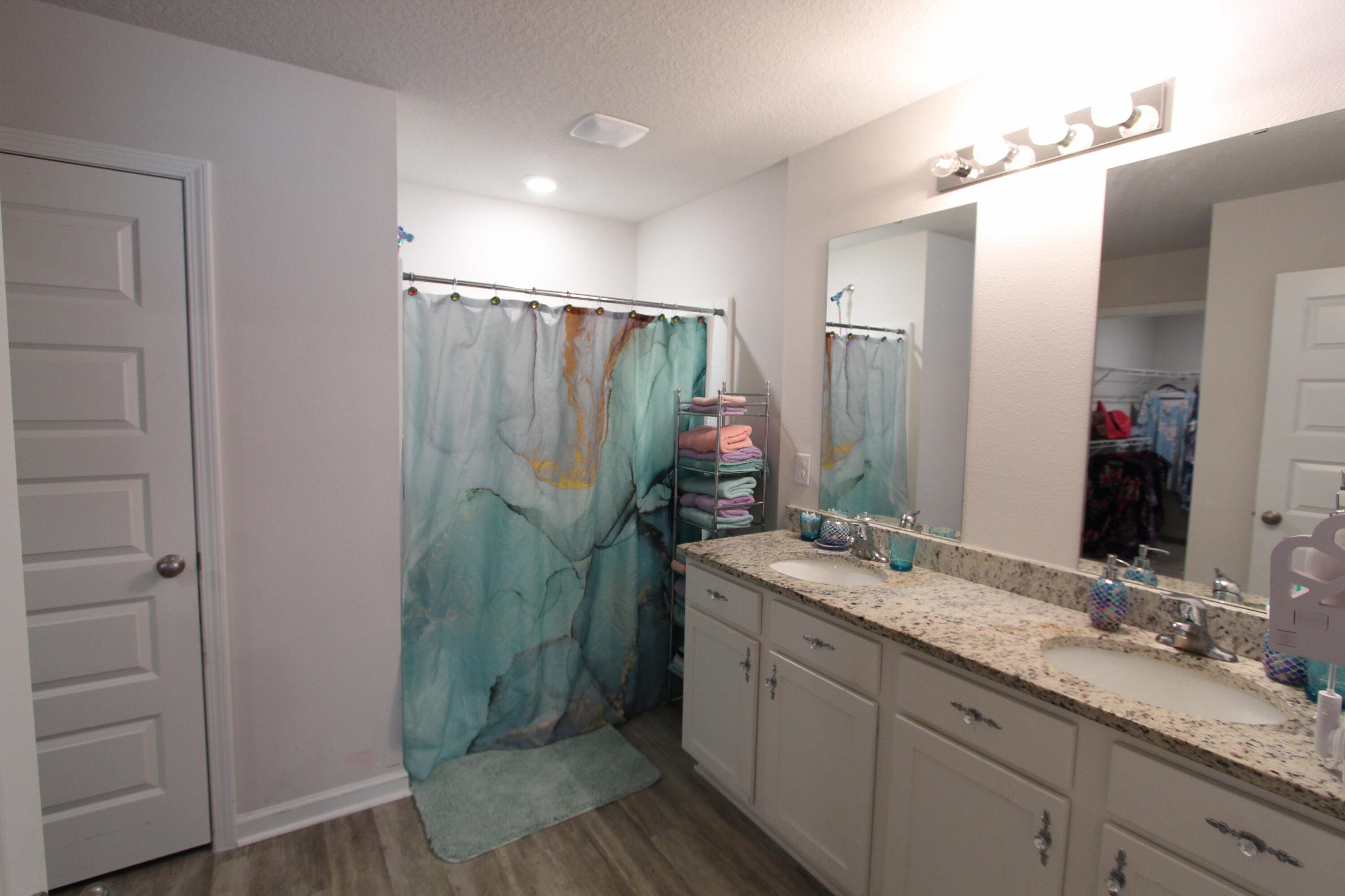5372 Wyndell Circle Crestview, FL 32539 - Photo 35 of 36 a bathroom with a double vanity sink and mirror