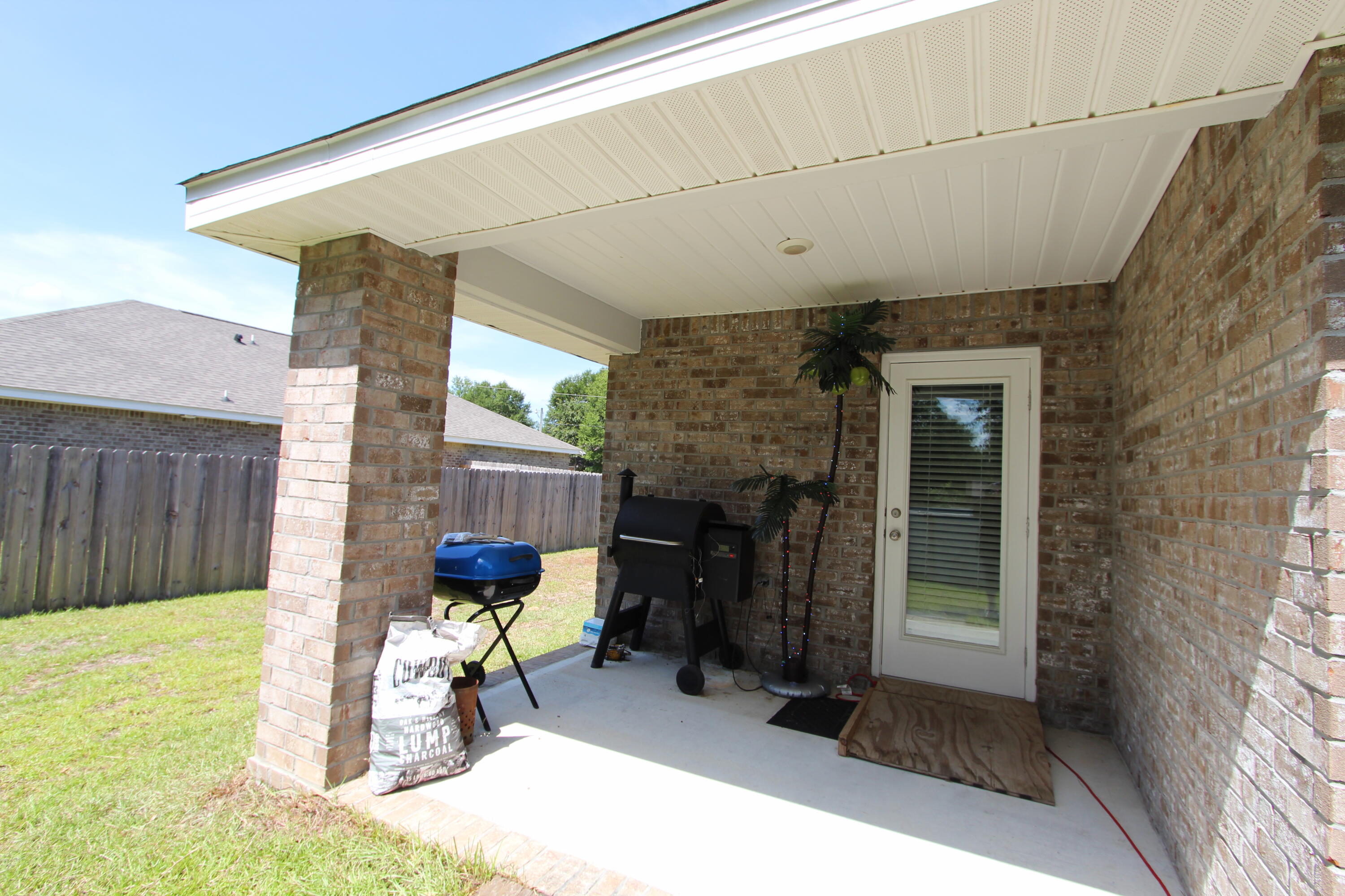 5372 Wyndell Circle Crestview, FL 32539 - Photo 6 of 36 a view of a porch with furniture and a yard