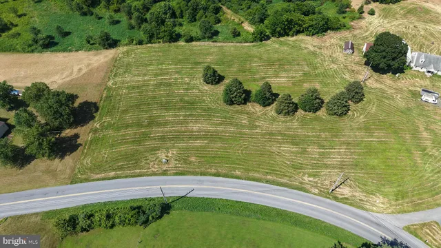 a view of fountain with a lake view