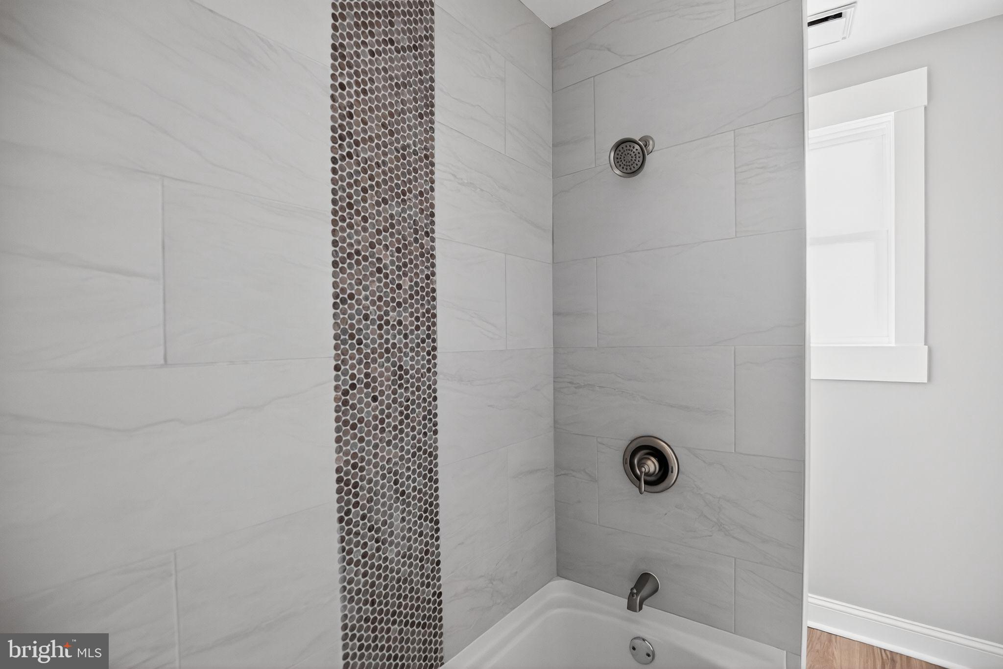 109 State Avenue Lindenwold, NJ 08021 - Photo 18 of 30 a bathroom with a bathtub and shower