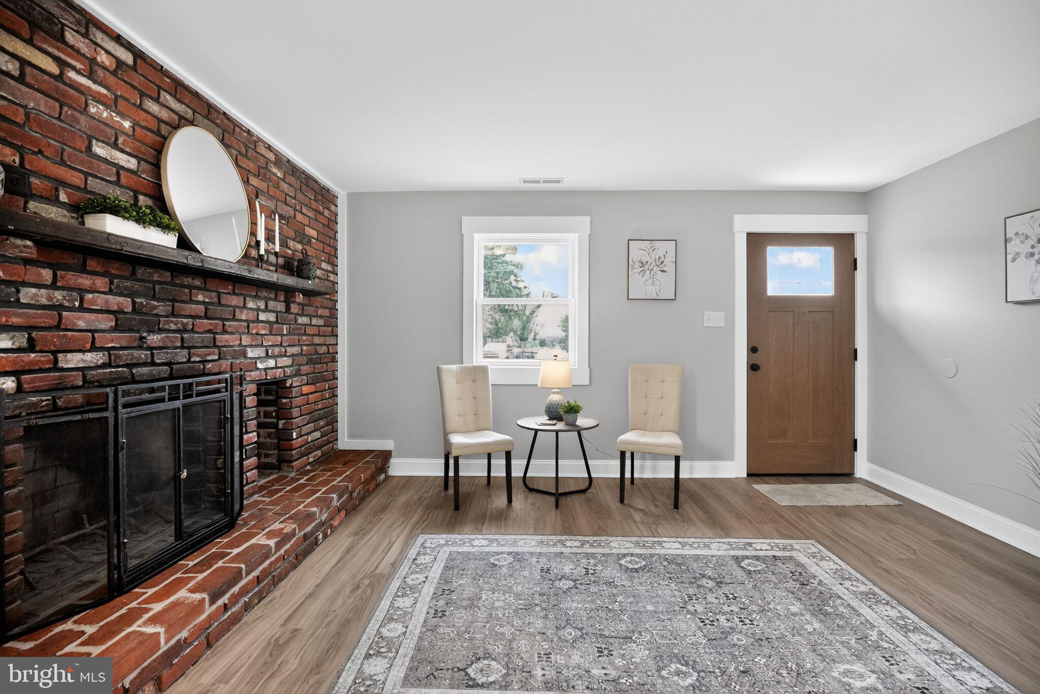 109 State Avenue Lindenwold, NJ 08021 - Photo 2 of 30 a living room with furniture wooden floor and a fireplace