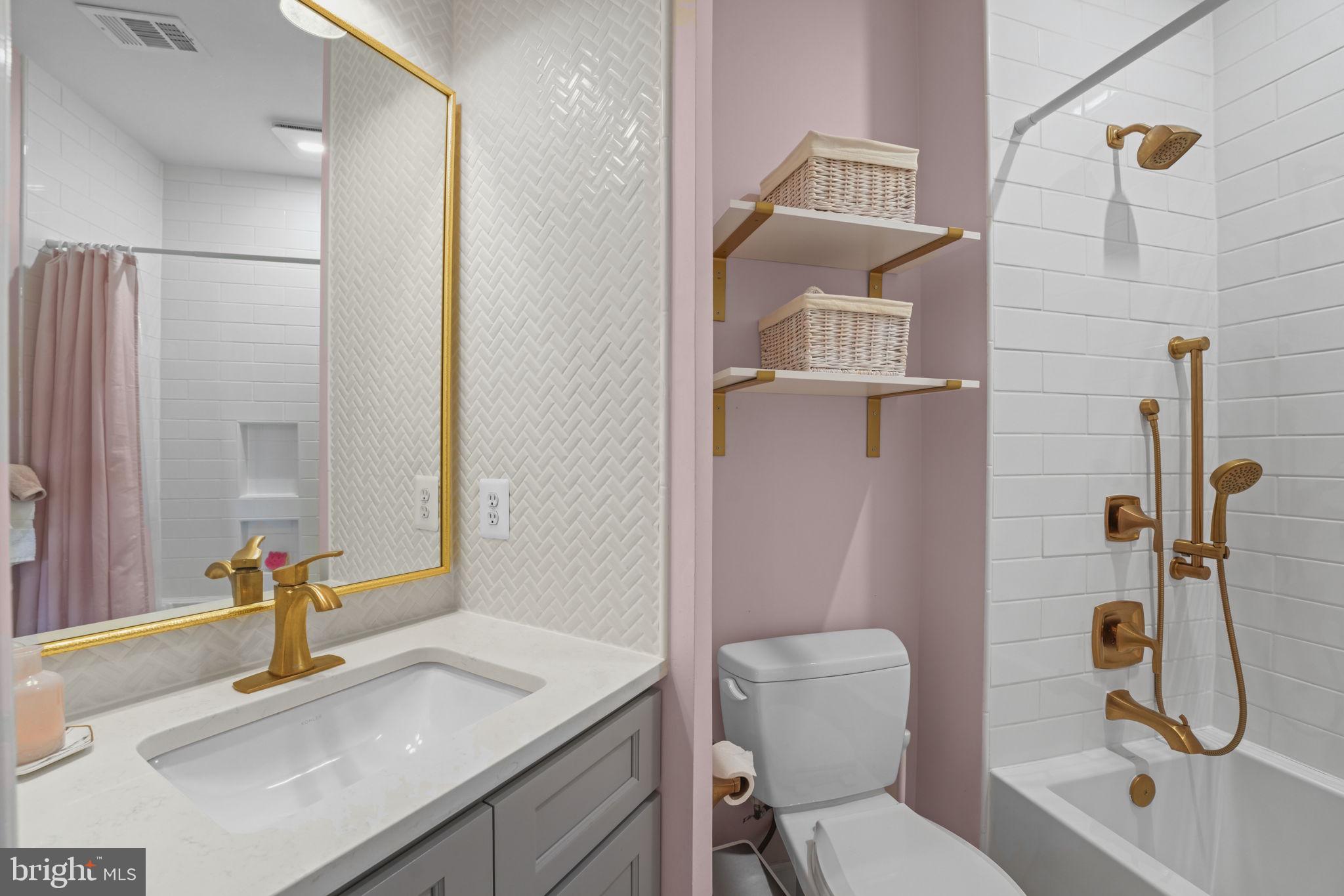 11431 Woolington Road Great Falls, VA 22066 - Photo 30 of 49 a bathroom with a sink toilet and shower