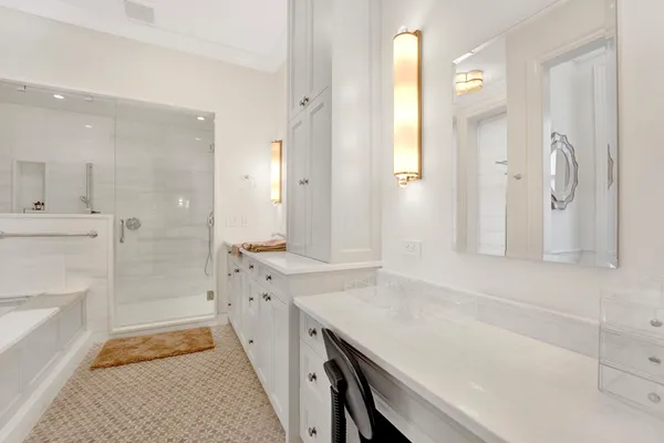 a bathroom with a bathtub and shower