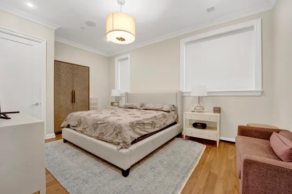 a bedroom with a bed and a cabinets