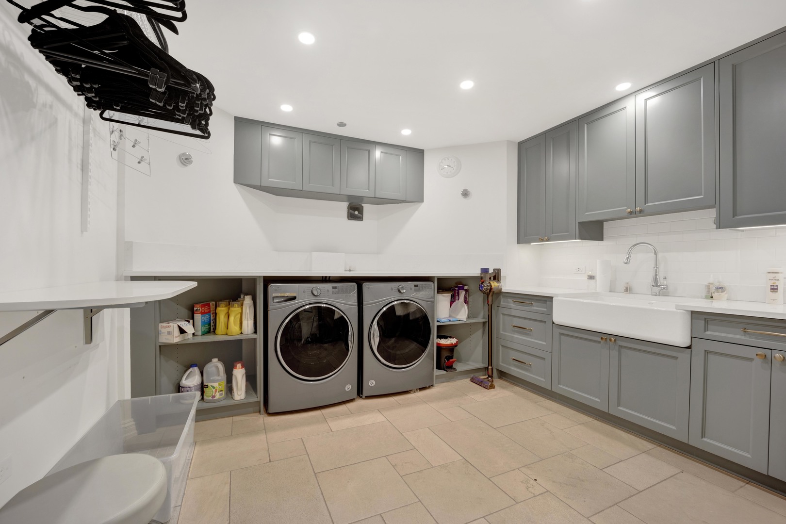 103 West Chestnut Street Chicago, IL 60610 - Photo 45 of 51 a utility room with sink dryer and washer