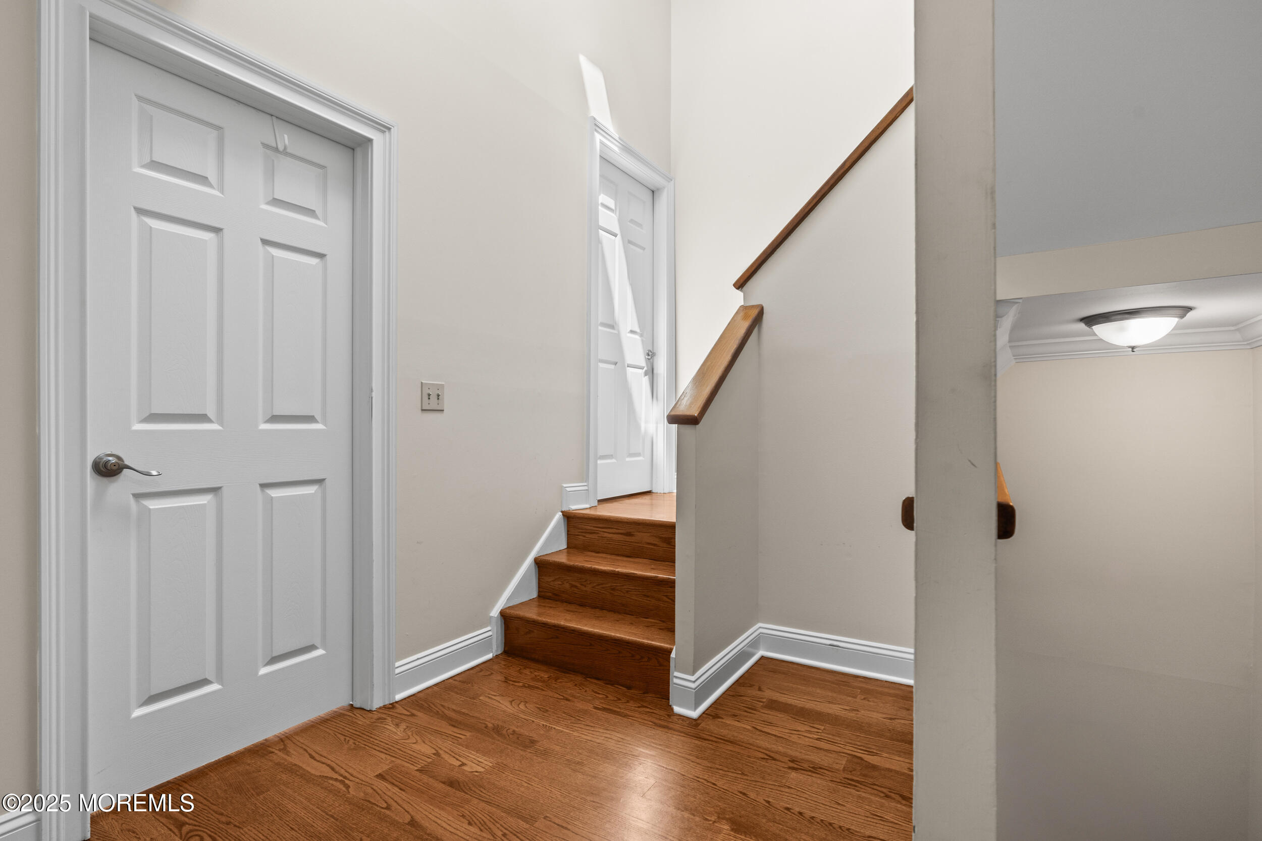 450 Ocean Boulevard, Unit 8 Long Branch, NJ 07740 - Photo 13 of 33 a view of entryway with stairs and wooden floor