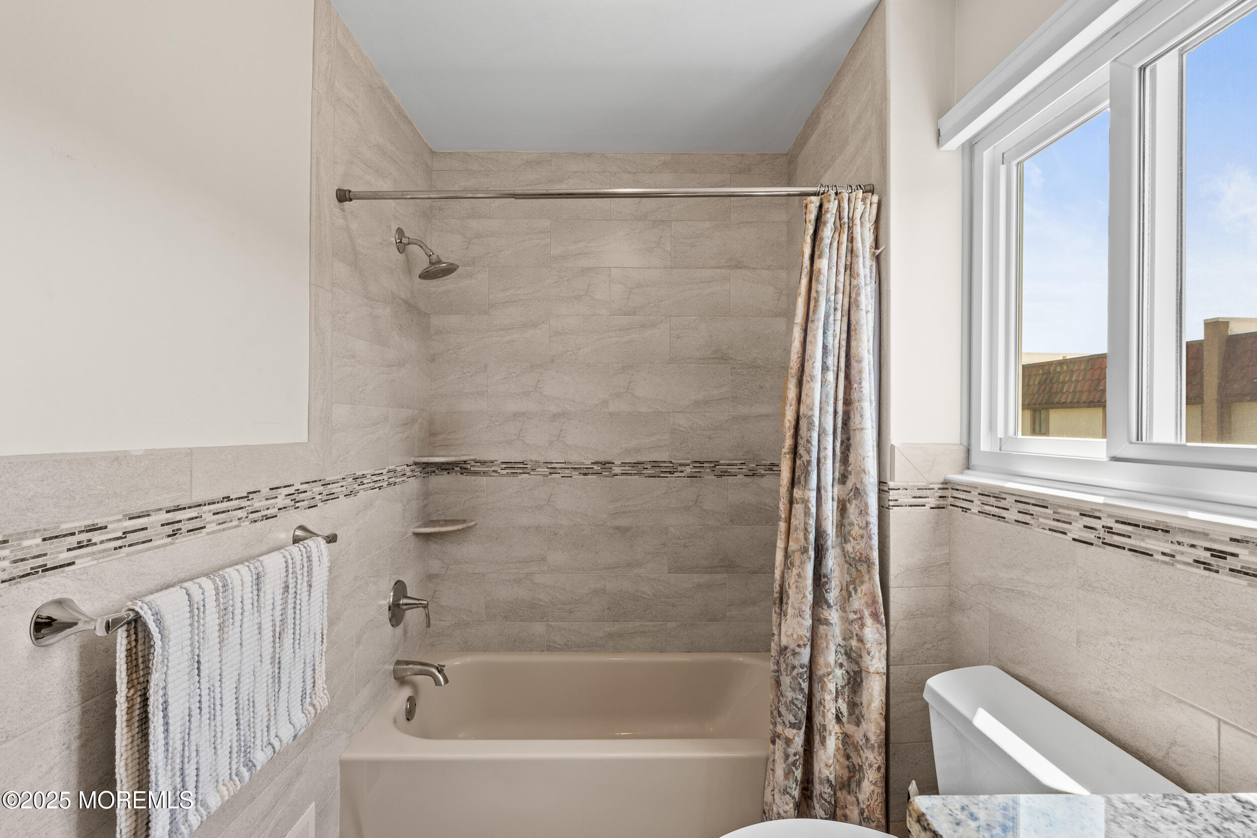 450 Ocean Boulevard, Unit 8 Long Branch, NJ 07740 - Photo 16 of 33 a bathroom with a shower and a bathtub