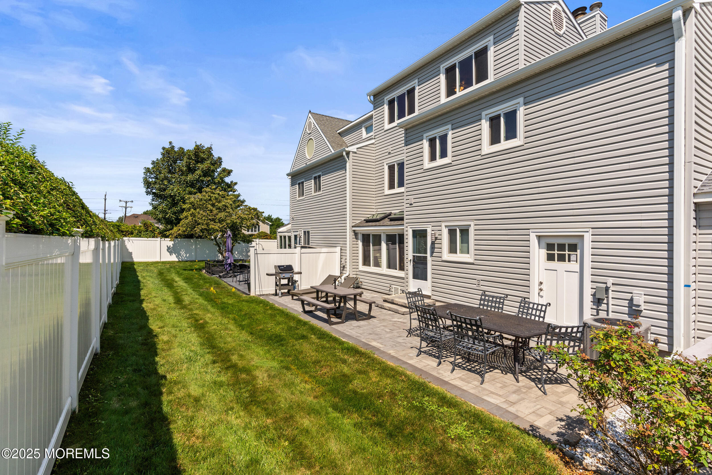 450 Ocean Boulevard, Unit 8 Long Branch, NJ 07740 - Photo 28 of 33 a aerial view of a house with swimming pool and sitting area